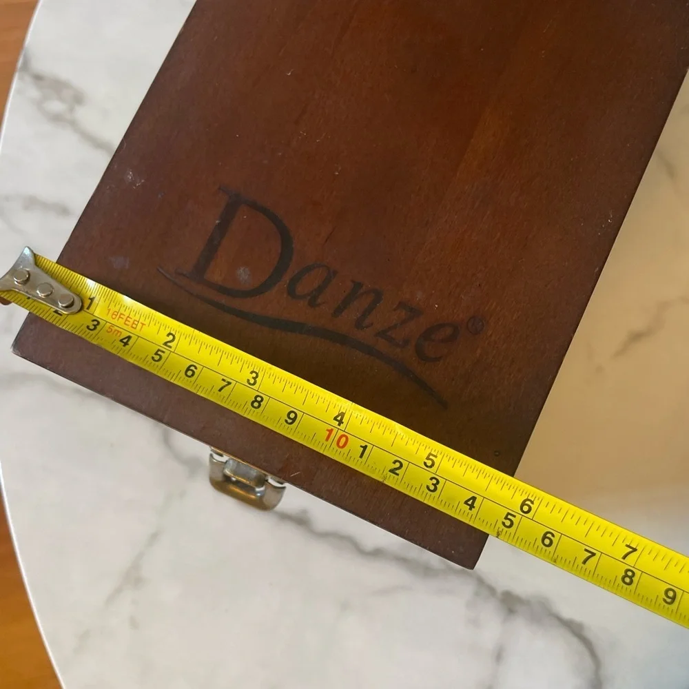 Wooden box for displaying coins with the name marked Danze logo